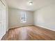 This bedroom features hardwood floors, white walls, a window, and a double door closet at 17 Cedars Glen Pl, Villa Rica, GA 30180
