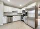Modern kitchen with white cabinets, stainless steel appliances, and ample counter space at 17 Cedars Glen Pl, Villa Rica, GA 30180
