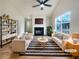 Bright living room with a fireplace, large window, and modern decor at 17 Cedars Glen Pl, Villa Rica, GA 30180
