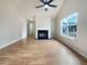 Spacious living room featuring a fireplace, large window and hardwood floors at 17 Cedars Glen Pl, Villa Rica, GA 30180