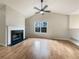 Spacious living room with a fireplace, large window and vaulted ceiling at 17 Cedars Glen Pl, Villa Rica, GA 30180