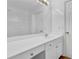 Bathroom showcasing a white vanity with storage and a large mirror with vanity lighting at 2612 Kirkhill Ct, Lawrenceville, GA 30044