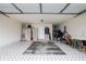 Clean and organized garage with storage shelves and patterned flooring at 2612 Kirkhill Ct, Lawrenceville, GA 30044