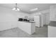 Bright eat-in kitchen with white cabinets, gray countertops, and tile flooring at 2612 Kirkhill Ct, Lawrenceville, GA 30044