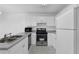 Modern kitchen features stainless steel appliances and ample cabinet space at 2612 Kirkhill Ct, Lawrenceville, GA 30044