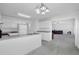 Spacious kitchen leading to Gathering room features white cabinets and stainless steel appliances at 2612 Kirkhill Ct, Lawrenceville, GA 30044