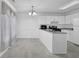 Bright eat-in kitchen features white cabinets, gray countertops, and stainless steel appliances at 2612 Kirkhill Ct, Lawrenceville, GA 30044