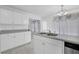 Bright kitchen offering a double basin sink and ample cabinets and counter space at 2612 Kirkhill Ct, Lawrenceville, GA 30044