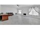 Open living room with tile floors, a fireplace, and large windows for natural light at 2612 Kirkhill Ct, Lawrenceville, GA 30044