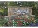 Stone sign welcomes you to the Lakeside community with colorful flowers at 1279 Lakeside Overlook, Canton, GA 30114