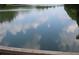 Beautiful lake view with still water reflecting the sky at 1279 Lakeside Overlook, Canton, GA 30114