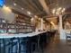 Upscale restaurant bar with a stocked liquor shelf, pendant lights, and a marble countertop at 1279 Lakeside Overlook, Canton, GA 30114