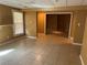 A large basement with tile flooring and a window features versatile open space for various uses at 1931 Harvest Way, Loganville, GA 30052