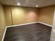 Bedroom with dark wood-look flooring, neutral paint, and a window provides comfort at 1931 Harvest Way, Loganville, GA 30052