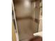 Bathroom with glass shower doors and floating shelves at 1931 Harvest Way, Loganville, GA 30052