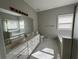 Spacious bathroom boasts double sinks, a large mirror, and a separate tub and shower at 1931 Harvest Way, Loganville, GA 30052