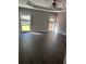 Spacious main bedroom with large windows, hardwood floors, and tray ceilings at 1931 Harvest Way, Loganville, GA 30052