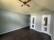 Bedroom with vaulted ceiling, ceiling fan, and multiple entry doors at 1931 Harvest Way, Loganville, GA 30052