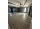 Expansive bedroom with hardwood floors, tray ceiling with fan, and large windows for natural light at 1931 Harvest Way, Loganville, GA 30052