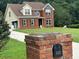 Well-manicured front yard with lush green grass and brick mailbox, enhancing the property's curb appeal at 1931 Harvest Way, Loganville, GA 30052