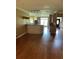 Open-concept kitchen with ample counter space and hardwood floors at 1931 Harvest Way, Loganville, GA 30052