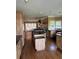 Spacious kitchen featuring wood cabinets, granite countertops, and a central island with modern appliances at 1931 Harvest Way, Loganville, GA 30052