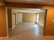 Spacious living room with neutral paint, tiled floor, and natural light provides a comfortable living space at 1931 Harvest Way, Loganville, GA 30052