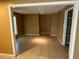Spacious living room with neutral paint, tiled floor, and natural light provides a comfortable living space at 1931 Harvest Way, Loganville, GA 30052