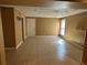 Spacious living room with neutral paint, tiled floor, and natural light provides a comfortable living space at 1931 Harvest Way, Loganville, GA 30052
