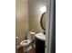 Cozy half bathroom featuring a vanity with a sink, mirror and toilet at 1931 Harvest Way, Loganville, GA 30052
