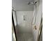 Shower stall features a handheld shower head, grab bar, and built-in soap dish at 1931 Harvest Way, Loganville, GA 30052