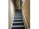 Carpeted stairway leads to the upper level of the house at 1931 Harvest Way, Loganville, GA 30052
