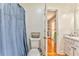 Bathroom with shower/tub combination with modern toilet and adjacent laundry room at 2738 Allyn Nw Way, Kennesaw, GA 30152