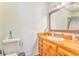 The bathroom has a wooden cabinet with a large mirror at 2738 Allyn Nw Way, Kennesaw, GA 30152