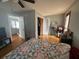 Bedroom showcasing a bed with a patterned coverlet and a sliding closet door at 2738 Allyn Nw Way, Kennesaw, GA 30152