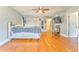 Large bedroom featuring hardwood floors, natural light, and access to the hallway at 2738 Allyn Nw Way, Kennesaw, GA 30152