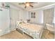 Serene bedroom with soft carpet, ceiling fan, and natural light from large windows at 2738 Allyn Nw Way, Kennesaw, GA 30152