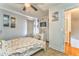 Cozy bedroom with ceiling fan, desk and hardwood floors leading to the hallway at 2738 Allyn Nw Way, Kennesaw, GA 30152