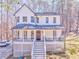 Charming two-story home featuring a welcoming front porch and well-maintained landscaping at 2738 Allyn Nw Way, Kennesaw, GA 30152