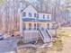 Inviting two-story home with a classic white exterior, front porch, and well-manicured lawn at 2738 Allyn Nw Way, Kennesaw, GA 30152