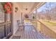 A covered front porch with seating and a decorated entrance at 2738 Allyn Nw Way, Kennesaw, GA 30152