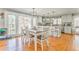 Bright, open kitchen and dining area with hardwood floors and large windows at 2738 Allyn Nw Way, Kennesaw, GA 30152