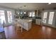 Well-lit kitchen with island, stainless appliances, and outdoor view at 2738 Allyn Nw Way, Kennesaw, GA 30152