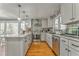 Spacious kitchen with island, pendant lighting, stainless appliances, and hardwood floors at 2738 Allyn Nw Way, Kennesaw, GA 30152