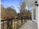 Balcony featuring iron railings with a view of trees and nature at 3670 River Mansion Dr, Peachtree Corners, GA 30096
