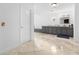 Large bathroom with marble floors, grey cabinets, and a round window at 3670 River Mansion Dr, Peachtree Corners, GA 30096