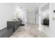 Large bathroom with double sinks, marble floors, and two entry doors at 3670 River Mansion Dr, Peachtree Corners, GA 30096