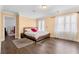 Bedroom featuring a bed with wood frame, wood floors, and a walk through to another bedroom at 3670 River Mansion Dr, Peachtree Corners, GA 30096