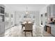 Inviting dining room with stone floors, a chandelier, and lots of natural light at 3670 River Mansion Dr, Peachtree Corners, GA 30096
