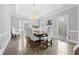 Formal dining room with a large table, elegant chandelier, and classic trim at 3670 River Mansion Dr, Peachtree Corners, GA 30096